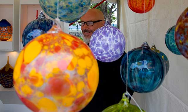 These colorful glass orbs are part of an artist’s display at the Peoria Art Guild’s annual riverfront art fair, which recently celebrated its 51st year. (Peoria CVB photo)