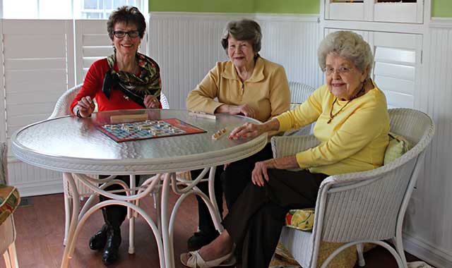 Carol Coulson, Patsy Hanschman and Virginia Monken enjoy the activity rooms and inviting community at Delnor Glen Senior Living, in St. Charles, which was recently recognized for its focus on personalized care. (Blake Nunes photos)