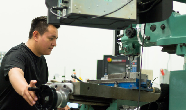 Christian Reyes, a recent graduate of Palatine High School, works at Felsomat, in Schaumburg, when he’s not in class at Harper College, where he’s learning additional manufacturing skills. (Samantha Ryan photo)