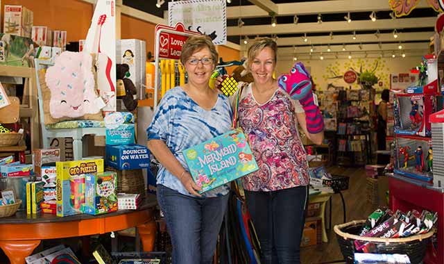 Lori and Kate McConville, the mother-daughter duo behind Marvin’s Toy Store in Crystal Lake, thoroughly research every product on display. (Samantha Ryan photo)
